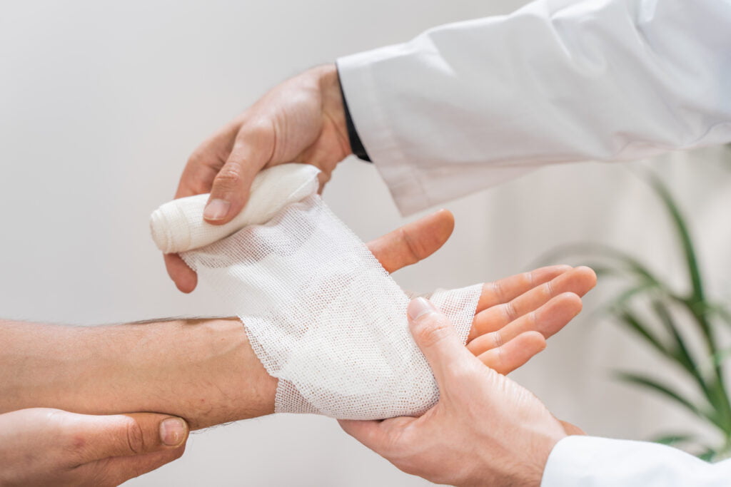 medical bandage on patient hand in clinic traumat 2023 11 27 05 14 39 utc