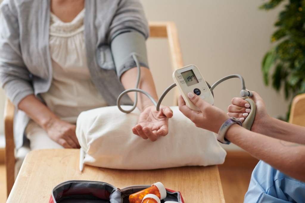 nurse checking blood pressure of patient 2023 11 27 05 09 04 utc